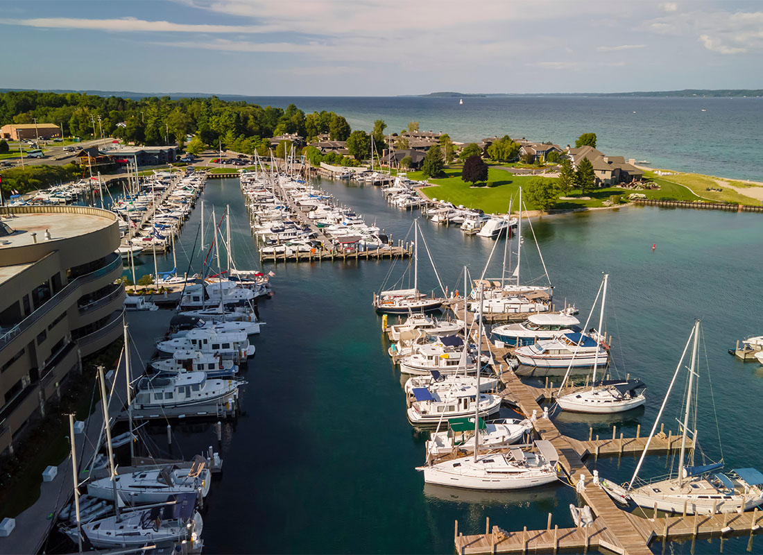 Contact - View of a Harbor Full of Docked Boats on a Sunny Day on Lake Michigan